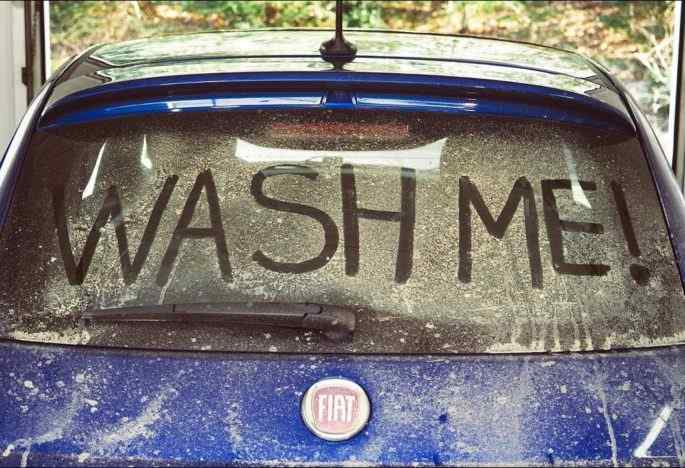 "Wash Me" Writings on a Car